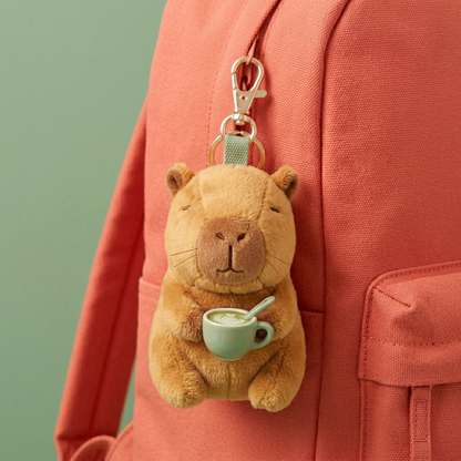 Capybara charm on coral backpack