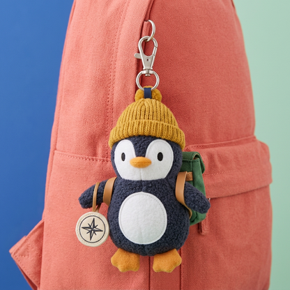 Explorer Penguin clipped to coral backpack with silver-tone lobster clasp