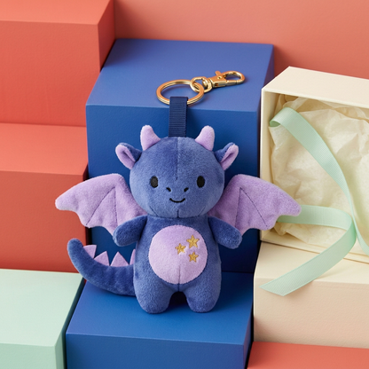 Midnight Dragon beside open unbranded ivory gift box and mint ribbon