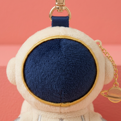Close-up navy fabric visor gold rim and ivory astronaut helmet